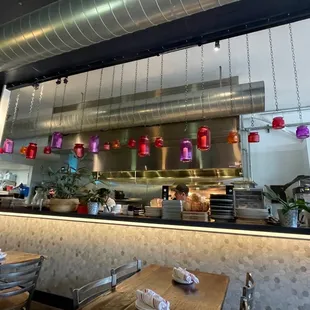 a restaurant with a large kitchen