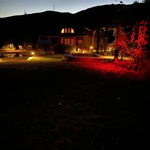 Night view of pool and sun room