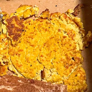 Tiny, squished portion of tofu scramble. It really could of used some veggies or sauce.