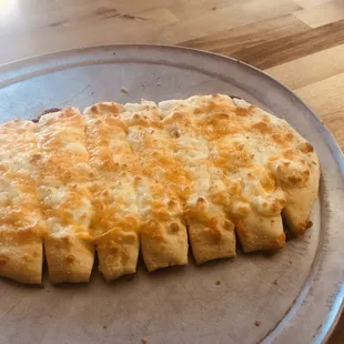 Spiral Bread - Homemade Breadsticks with Garlic Butter, Parmesan Cheese, and Topped with Mozzarella and Cheddar