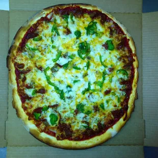 The Spiral Special - Our most Popular Pizza.    Sausage, Pepperoni, Onion, Celery, Green Pepper, and a sprinkle of Cheddar on top.