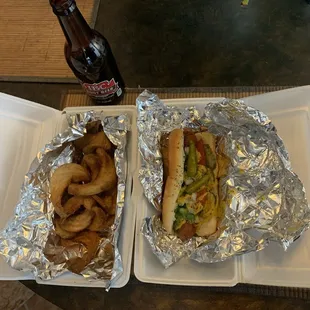 Spiral cut fries on left. Chicago Dog on Right. IBC Root Beer upper left