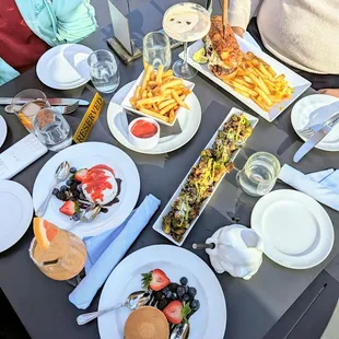 Beef brisket hamburger, fries (papas fritas), brussel sprouts, strawberry tres leches cake, chocolate caramel flan