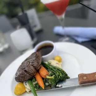 a steak and vegetables on a plate