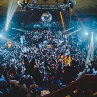 a large crowd of people at a nightclub