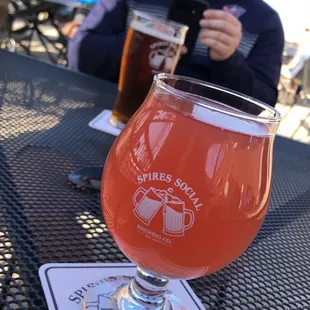 a glass of beer on a table