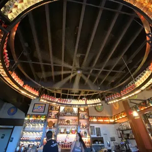 Bottles of spirits hanging above the bar