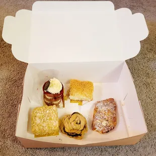 a variety of pastries in a box