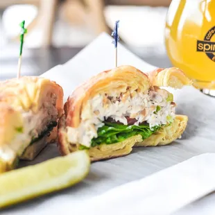 a sandwich and pickle on a napkin