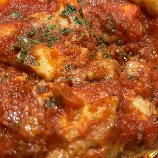 EGGPLANT PARMIGIANA (five layers of lightly battered and fried eggplant, mozzarella, and tomato gravy) with cheese ravioli