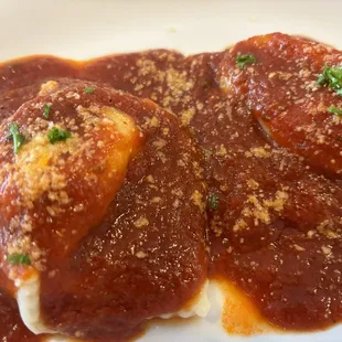 EGGPLANT PARMIGIANA (five layers of lightly battered and fried eggplant, mozzarella, and tomato gravy) with cheese ravioli