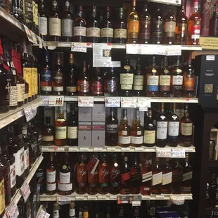 a shelf of liquor bottles
