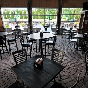 empty tables and chairs in a restaurant