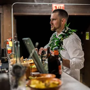 Groom chatting with the bar