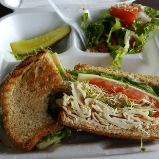 Turkey with avocado on toasted wheat and side Greek salad included!