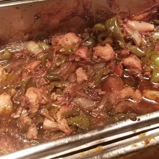 a pan of stew with meat and vegetables