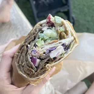 a person holding a wrap