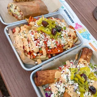 The Zesty Feta Doner with chicken, the street fries mixed with waffle and regular fires, and the Doquitos with Beef &amp; Lamb