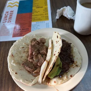 a plate of tacos and a cup of coffee