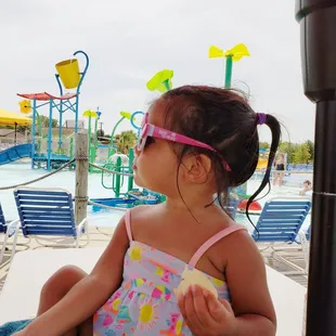 Baby enjoying the sun! Plus the kiddie pool behind her
