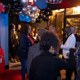a woman in a red feathered dress
