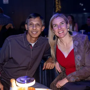 a man and a woman sitting next to each other