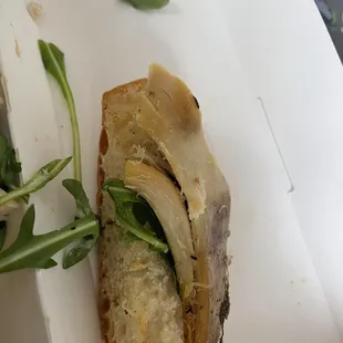a sandwich in a styrofoam container