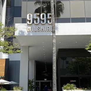 Outside. Just walk through the large door and you will see the cafe