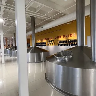 a row of stainless steel tanks