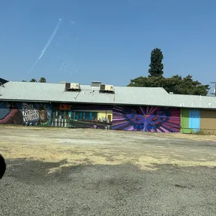 a colorful mural on the side of a building