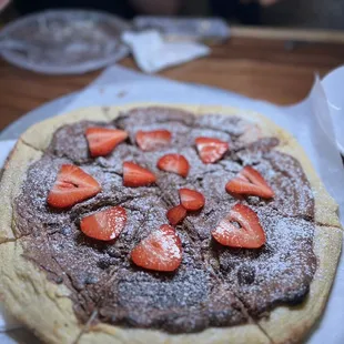 a chocolate pizza with strawberries