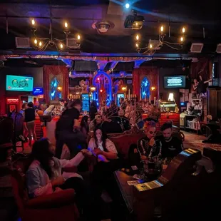 a group of people sitting at a bar