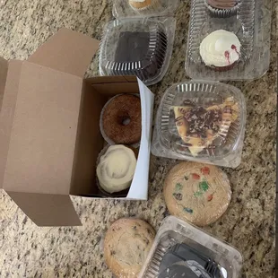 Monster cookies, cinnamon bun, vegan brownie, lemon cupcake, red velvet cupcake, peanut butter solution, chocolate cupcake, cinnamon donut