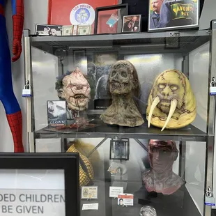 a display case filled with masks