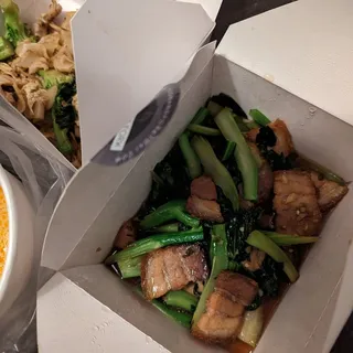 Stir fried crispy pork belly over rice