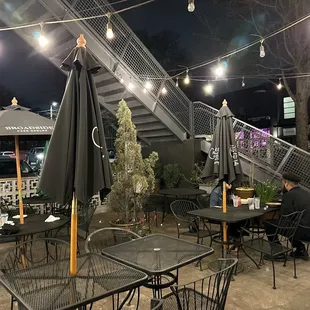 tables and chairs outside at night