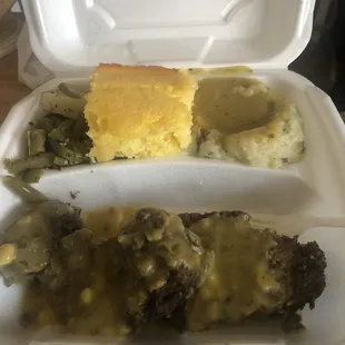 Meatloaf w/gravy, mashed potatoes w/gravy and string beans and potatoes