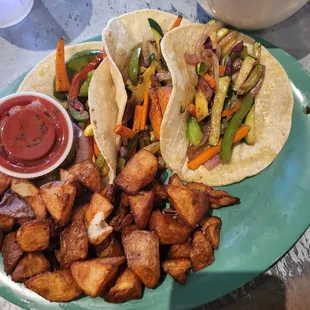 Veggie tacos, no feta, extra cottage potatoes to make vegan breakfast tacos!