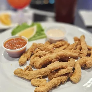a plate of deep fried chicken nuggies