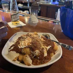 Loaded tots, with a cup of chili dumped on it