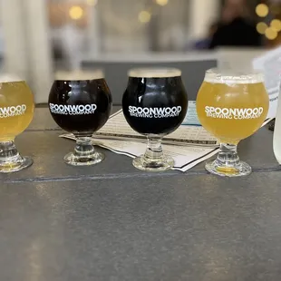 three glasses of beer on a table