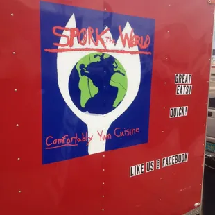 a red trailer with a green globe on it