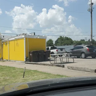Back side of the restaurant. About 7th car back.