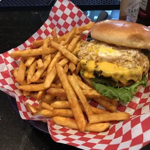 Over easy egg burger with hot fries very tasty