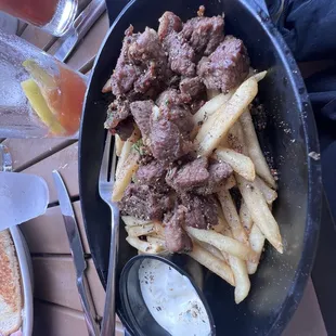 Steak bites over fries