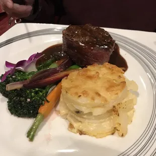 Bacon wrapped filet with broccoli rabe and scalloped potatoes