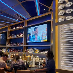 people sitting at a bar