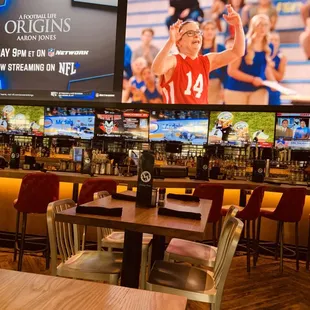 a sports bar with large screens