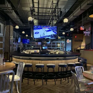 a sports bar with bar stools