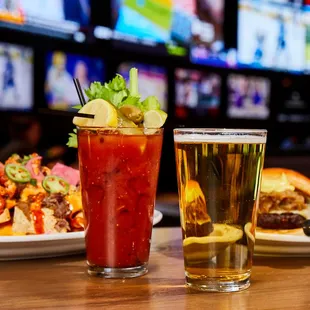 a glass of beer and a plate of food